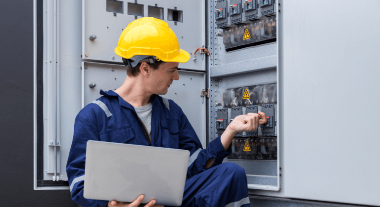 Engineer inspecting system quality and compliance for ABB equipment